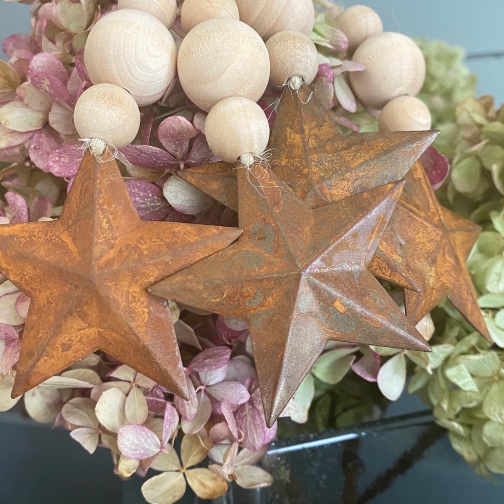 4 wood and tin star ornaments